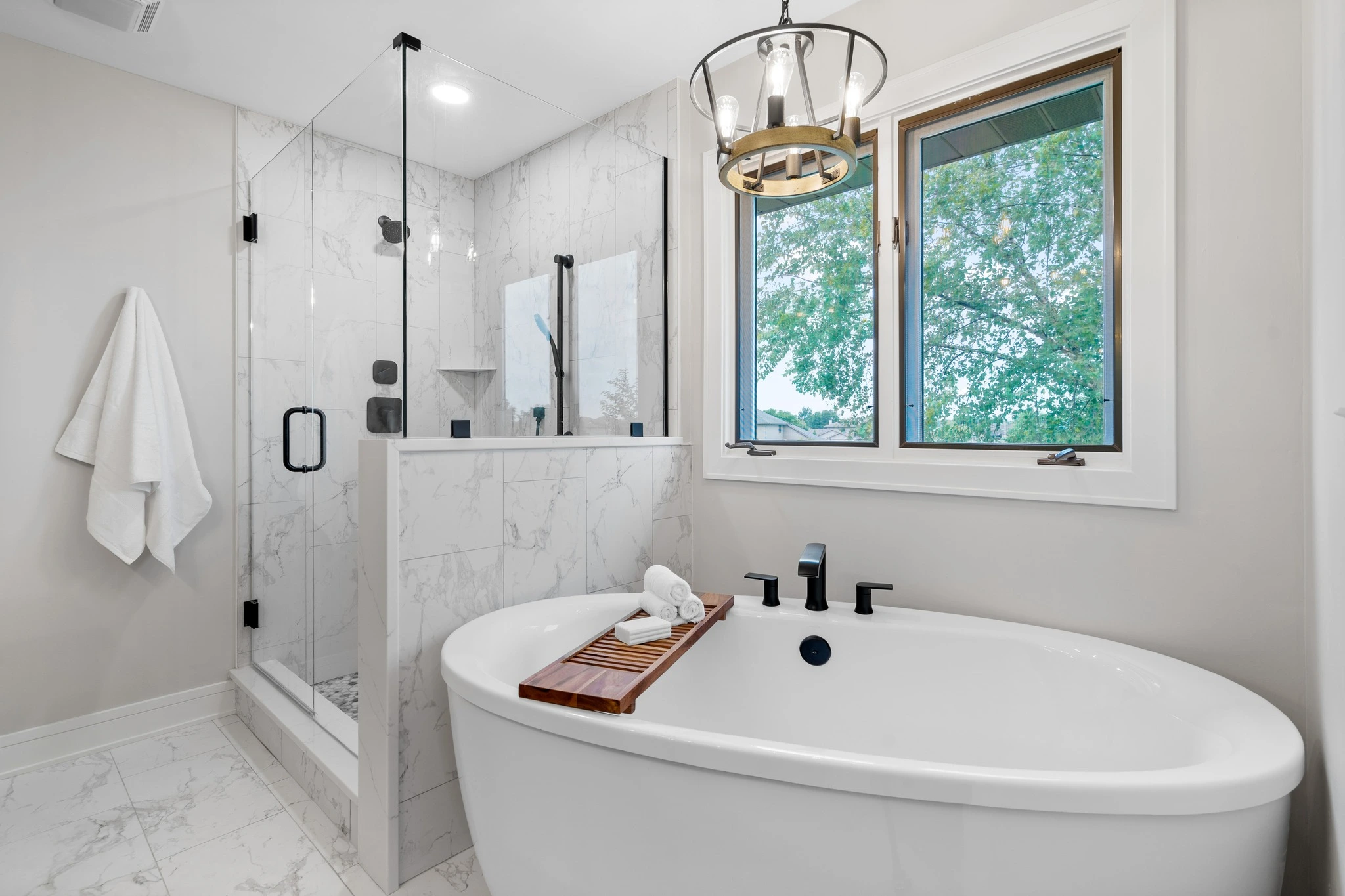 Updated bathroom with tile shower and shelving
